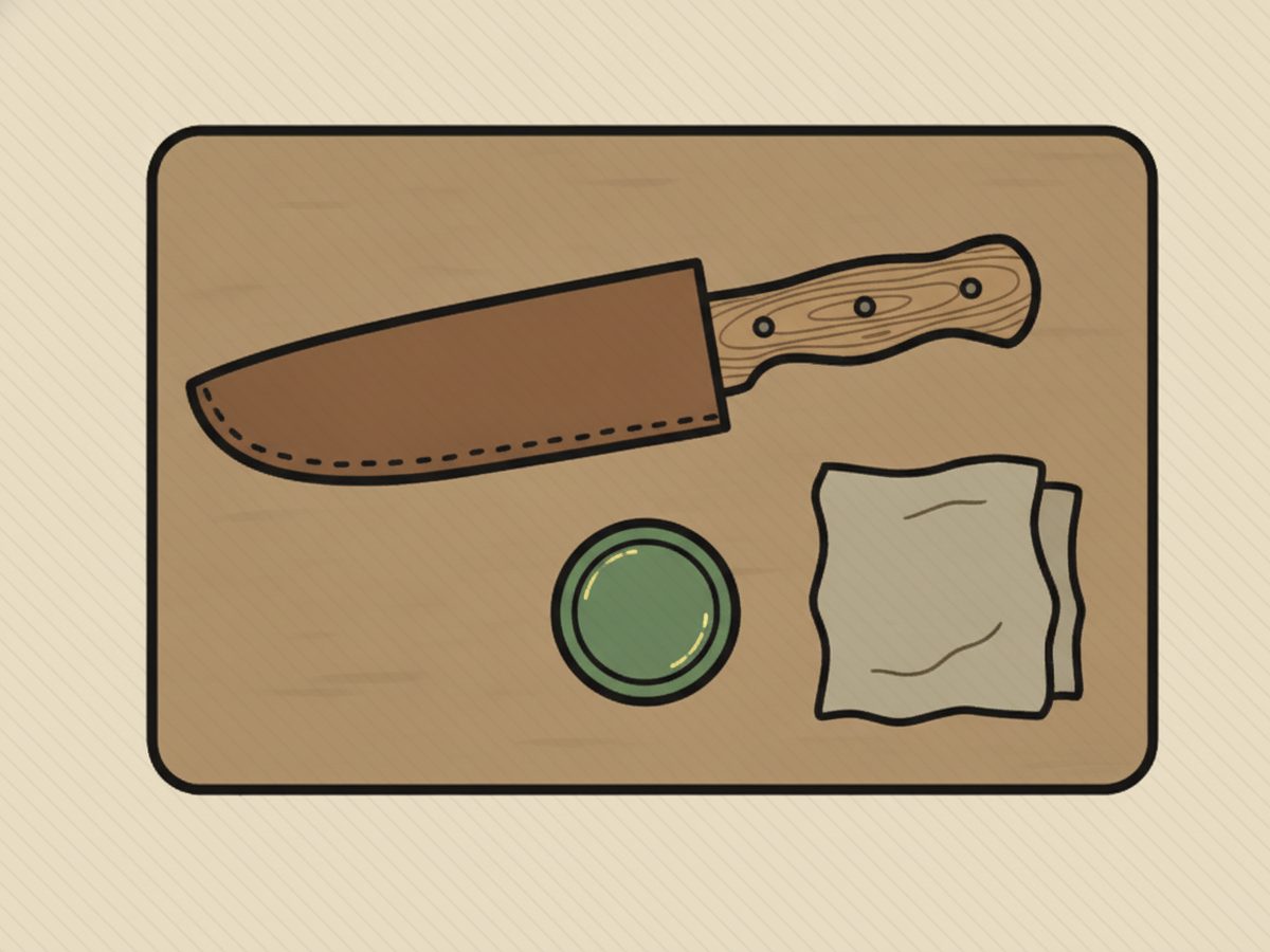 Bushcraft knives sheath and care: leather sheath, oil tin and a dry cloth laid out on a board
